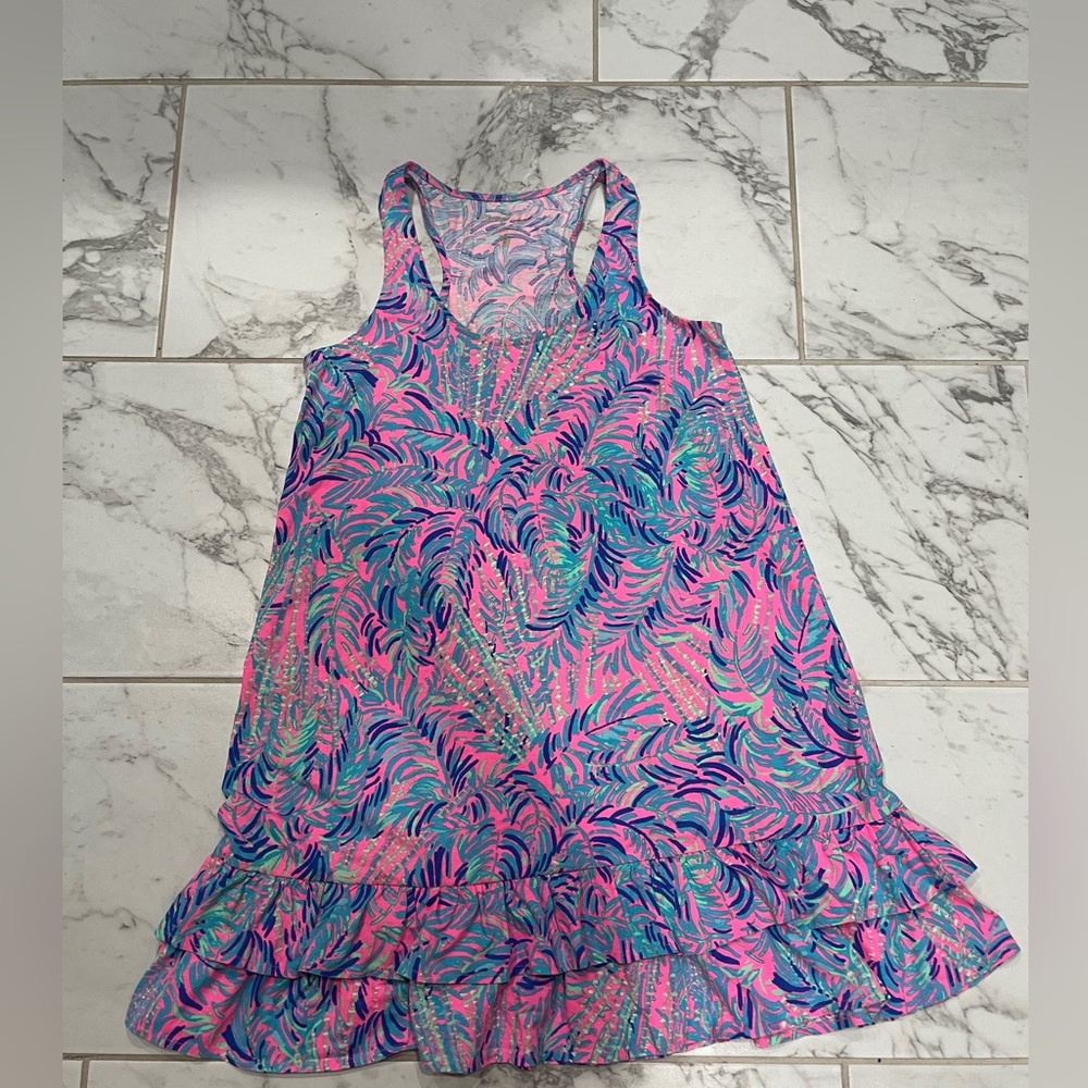 Lilly Pulitzer swimsuit cover up with cute ruffle details in the bottom.